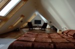 Home cinema and bed in loft conversion